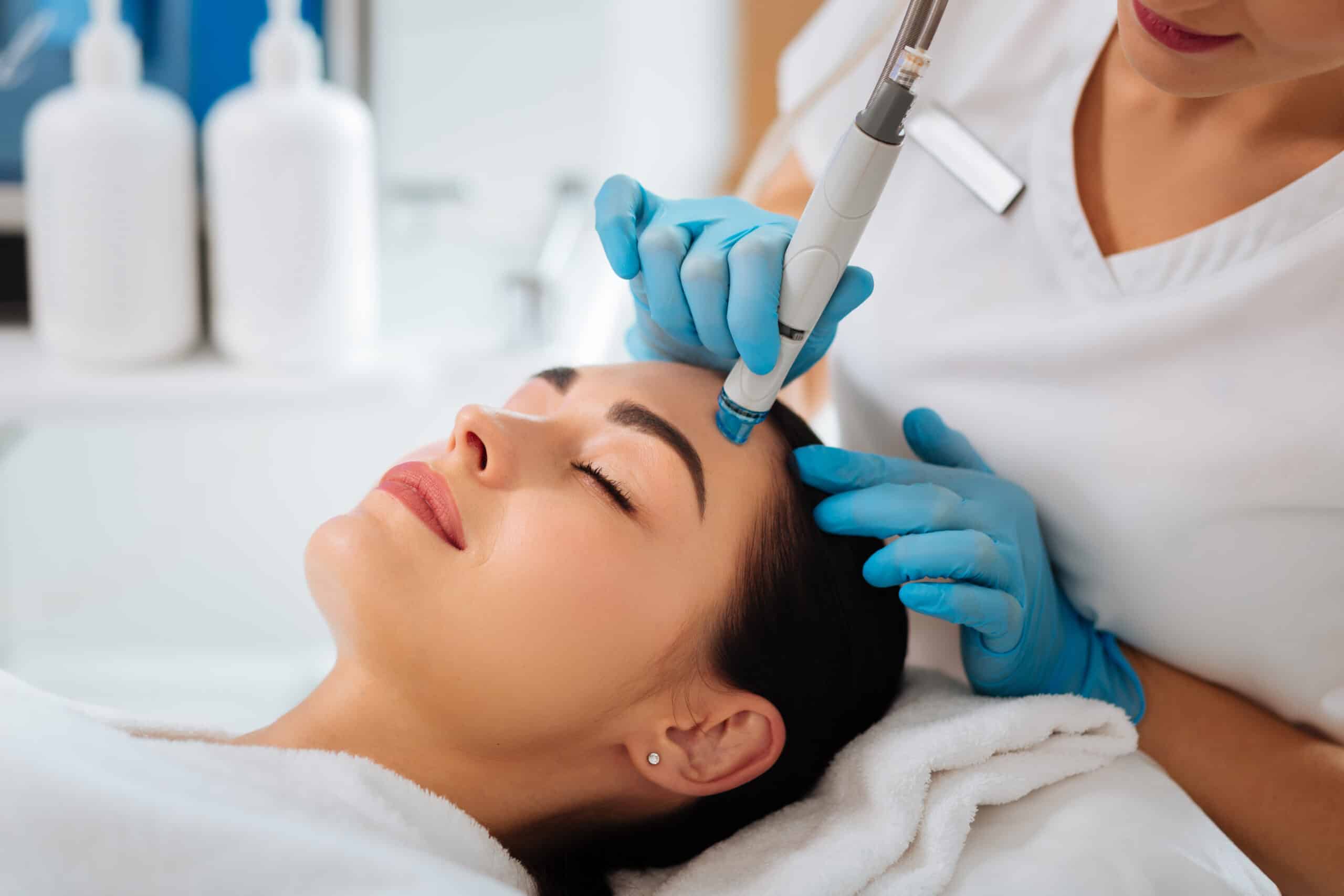 Young Girl Receiving Hydrafacial from Aesthetician | Prick'd Medspa in St. Louis, MO